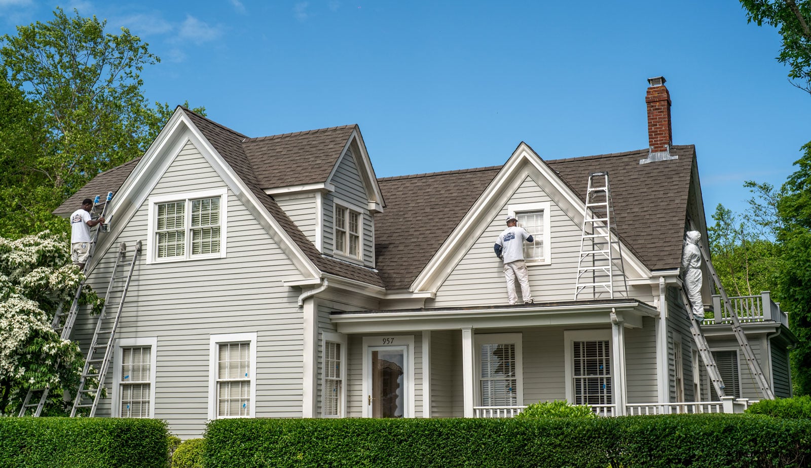 House painters on ladders