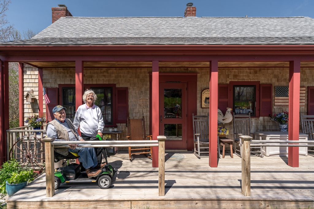 2022 Paint it Forward Winners sitting on porch