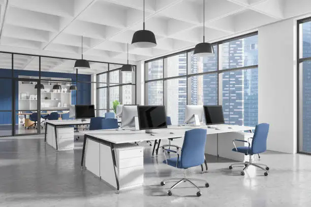 Office interior with freshly painted blue accent walls and crisp white trims by a painter in Cape Cod, MA.
