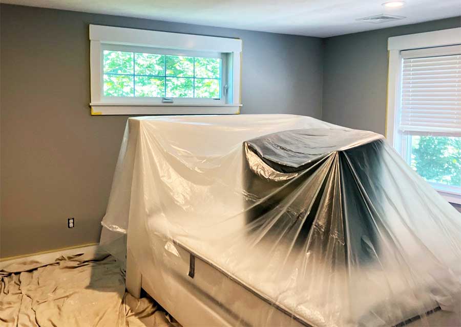Furniture covered in prepping to paint interior room